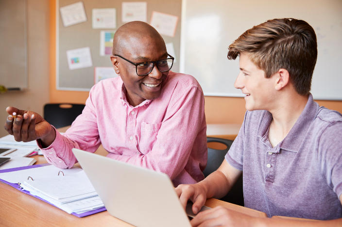 You can be a tutor (or hire a tutor) at Dash Class. A tutor helping a student.